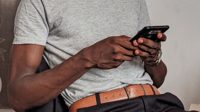 Picture of a man trying to top up his mobile phone on O2